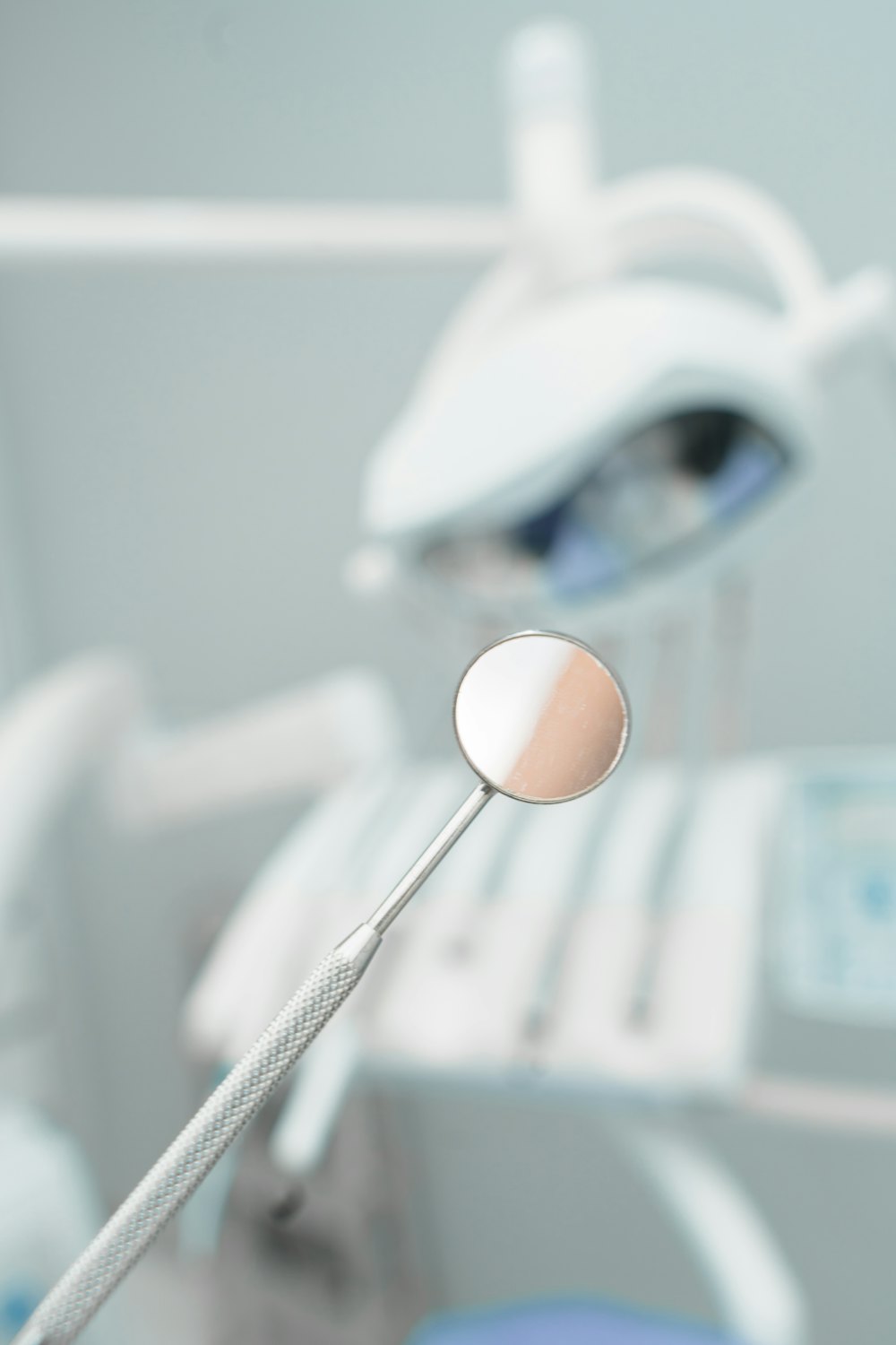 Dental mirror in front of a treatment chair
